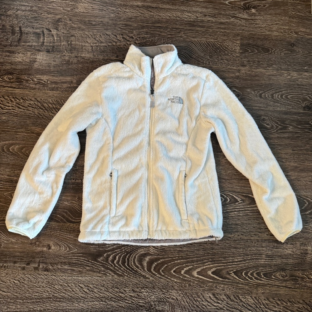 White fuzzy North Face jacket